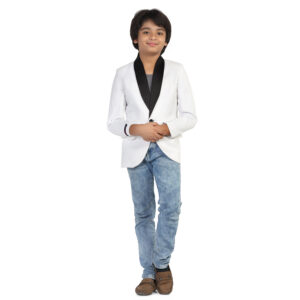 boy wearing white partywear blazer with blue jeans and brown shoes